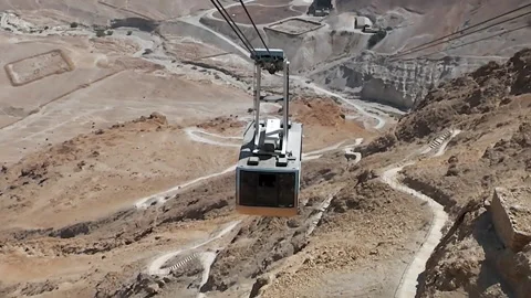 A cable car cabin is approaching to the upper station at Masada National Park Video stock 141225957