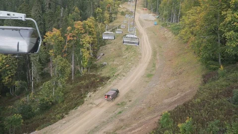 Cable car cabin in the mountains among the autumn forest Stock Footage 117414451