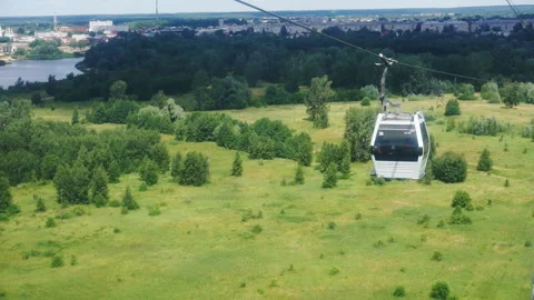 The cable car cabin moves against the backdrop of a beautiful landscape. Stock Footage 135342804