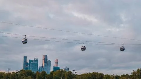 Cable car cabins cabins on the background of skyscrapers of the business center. Stock Photos
