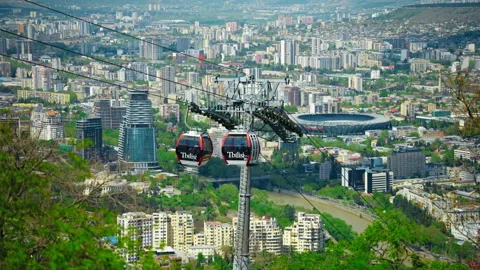 Cable Car Cabins Crossing The Sky Above Tbilisi Stock Footage 345440994