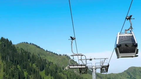 Cable car cabins, mountains in summer Stock Footage 295004954