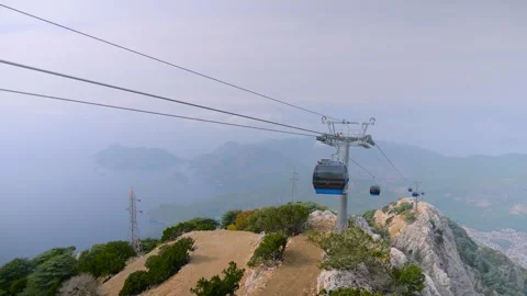 Cable car cabins moving above mountain slopes - Babadag Mountain Stockbeeldmateriaal 320891343