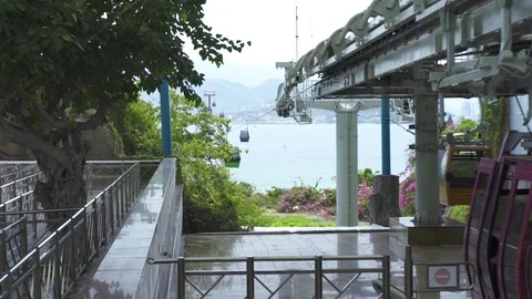 Cable car cabins moving on rope way for passenger transportation across sea in Video stock 106488982