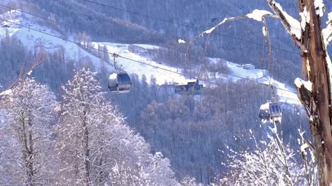 Cable car cabins passing in the winter mountains HD Stock Footage 151926251
