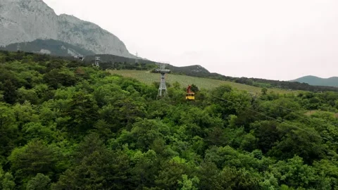 Cable car cableway funicular wagon rises up Mount. Transport to mountain top Stock Footage 170378874