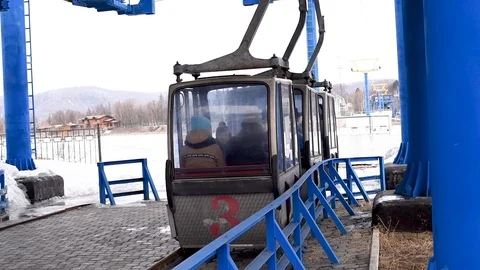 Cable car crossing the river in winter and summer Video stock 109416947