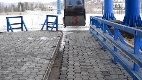 Cable car crossing the river in winter and summer Stock Footage 109416954
