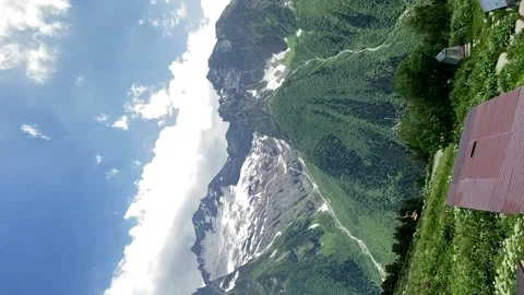 Cable car in the Dombay Russia. View of the snow-capped mountains. Video stock 202012252