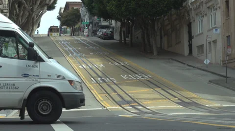 Cable car downhill intersection car pass San Francisco avenue public transport  Stock Footage 37562196