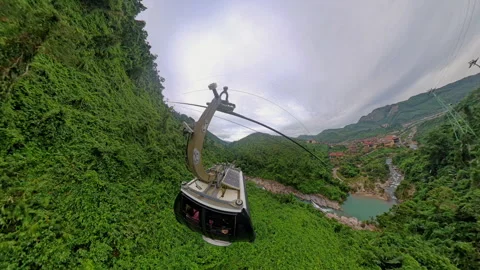 Cable Car Gliding Over Dense Forested Valley Viewed from Wide Angle with Deep Gr Vídeos de archivo 323473981