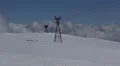 Cable Car Going Down Chairlift Passing Ski Resort Mountain Peak Winter Landscape HD Footage