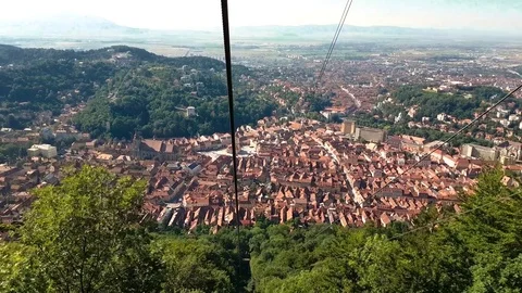 Cable car going up over Brasov, Romania Stock Footage 78671455