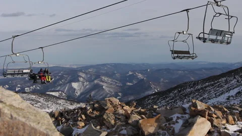 Cable car high in mountains, ski lift in Switzerland, people go uphill Stock Footage 132738709
