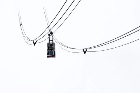 Cable car isolated on white background in foggy mountains Stock Photos