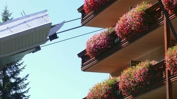 Cable car in motion next to a building. Stock Footage 86153212