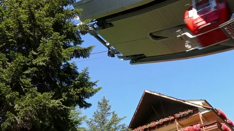 Cable car in motion next to a building. Video stock 86153386