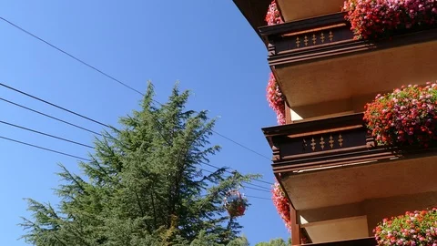 Cable car in motion next to a building. Video stock 86197474