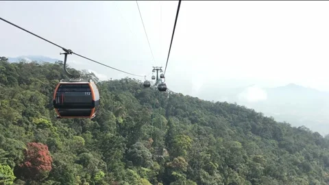 Cable car moving above green forest on Ba Na hills Stock Footage 151404538