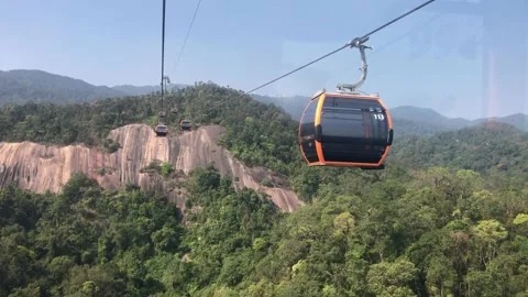 Cable car moving above green forest and cliff on Ba Na hills Video stock 151404719