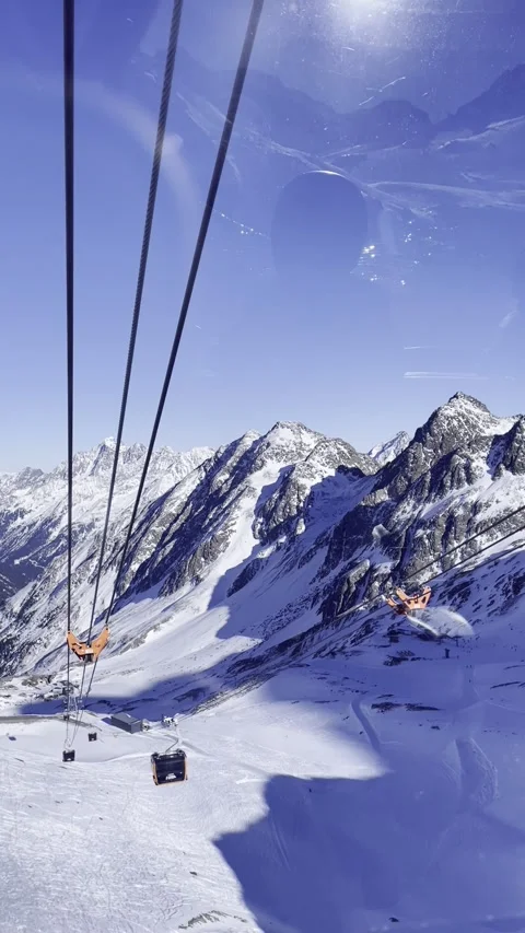 Cable car moving with snow mountain in the background, ski in winter Alps Video stock 257073934