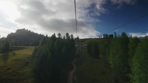 Cable car moving through forest with mountain view at Cinque Torri Dolomites Ita Video stock 320179091