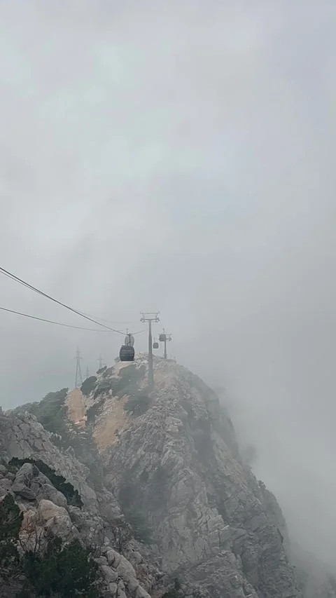 Cable car over mountains between clouds Stock Footage 337123934