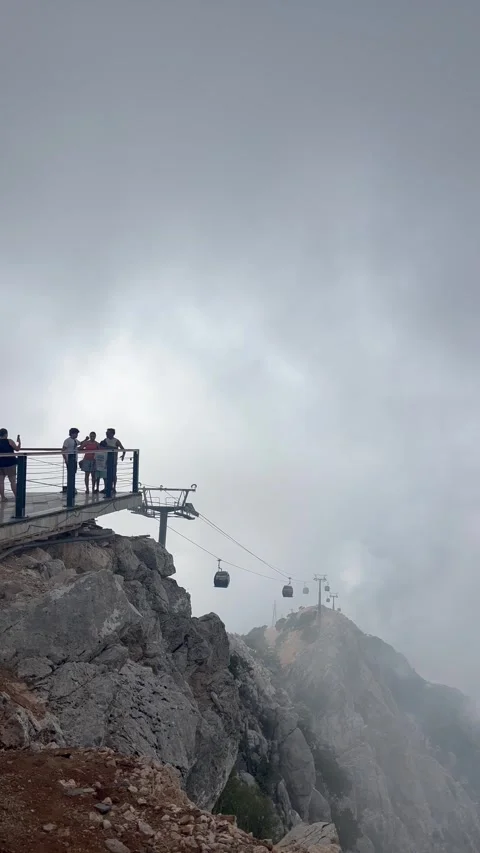 Cable car over mountains between clouds Stock Footage 337134200