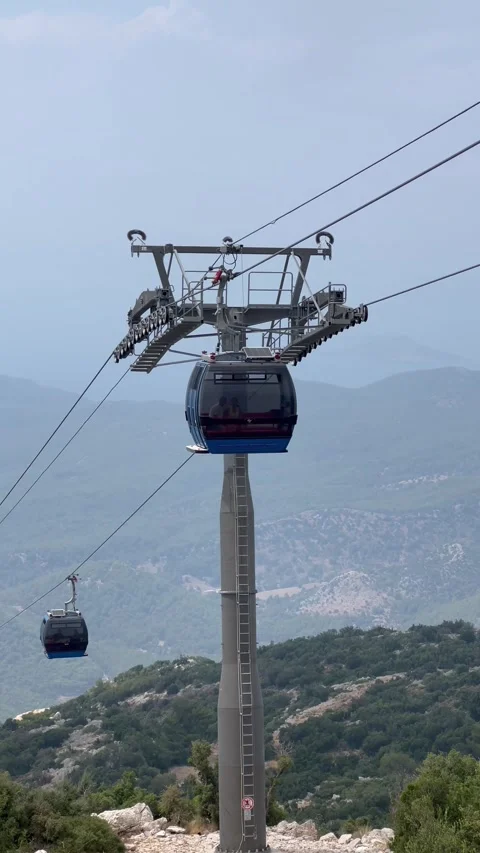 Cable car over mountains between clouds Stock Footage 337152697