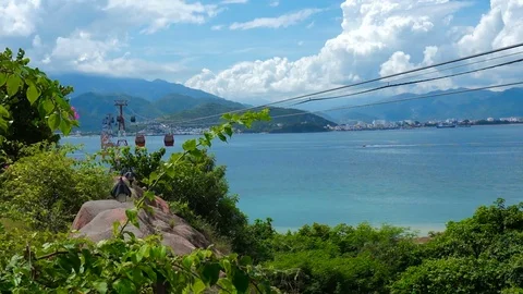 Cable car over the sea. Cloudy sky in the background. 스톡 동영상 70745592