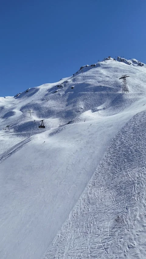 Cable car over slopes of Courchevel ski resort, carrying skiers to Sailure Stock Footage 334206721
