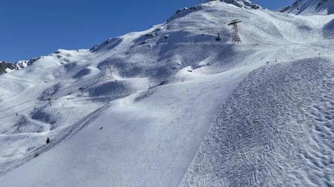 Cable car over slopes of Courchevel ski resort, carrying skiers to Sailure Stock Footage 334206887