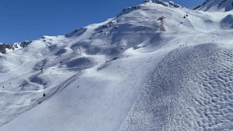 Cable car over slopes of Courchevel ski resort, carrying skiers to Sailure Stock Footage 334206989