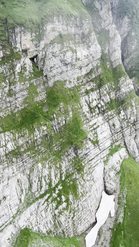 Cable car perspective snowy mountain entering cloud layer - Stock Footage 334327760