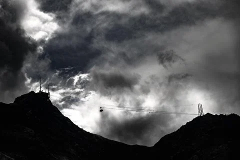 Cable car to Piz Murtel with dramatic clouds St Moritz Engadin Grisons Stock Photos