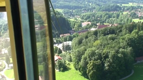 Cable car ride down an alpine mountain slope Video stock 77824881