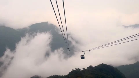 Cable Car Ride Going Down From Mountain Peak, Crossing Dense Fog and Clouds Vídeo Stock 342536324