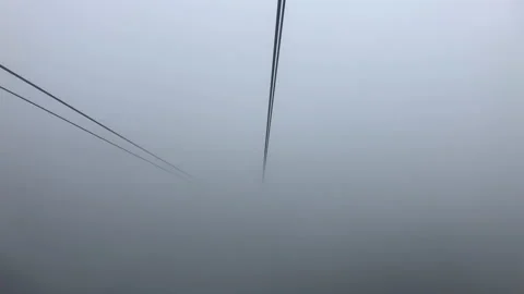 Cable car ride Ngong Ping 360 Hong Kong on rainy hazy cloudy day Stock Footage 133544979