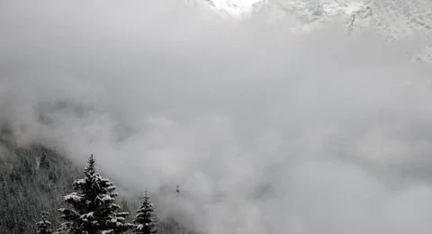 A cable car rises up the mountain Stock Photos
