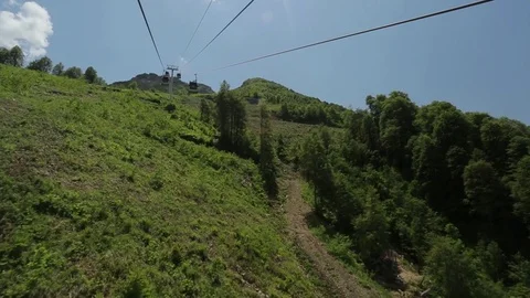 The cable car rises to the mountains Stock Footage