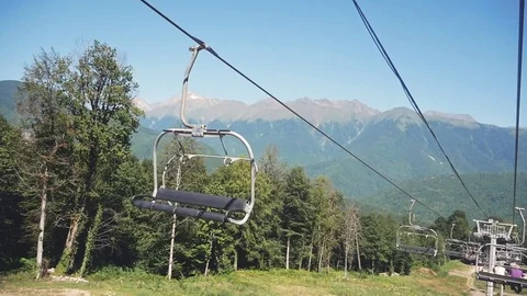 Cable car ropeway in the mountains summer sunny day Stock Footage 82939911