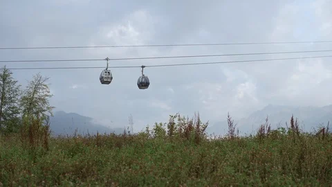 Cable car ropeway in the mountains at summer in sunny day, 4k Stock Footage 97720701