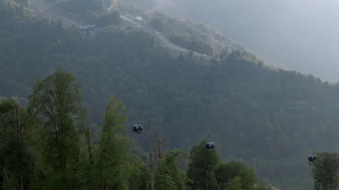 Cable car ropeway in the mountains at summer in sunny day, 4k Stock Footage 97720769