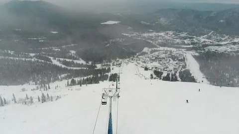 Cable car for skiers. aerial video Stock Footage