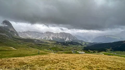 The cable car soars over Val Gardena, its path tracing a silent journey Stock Photos