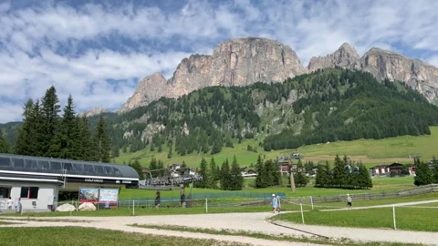 The cable car station of Colfosco and surrounding mountains Video stock 284462949