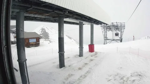 Cable car station on top of the mountain covered with snow, which come Stock Footage 71010644
