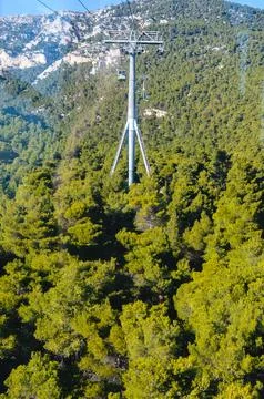 Cable car tower above pine forest in Mount Parnitha, Greece. Stock Photos