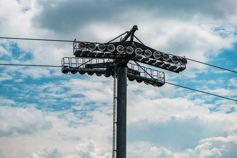 Cable car tower against blue sky and clouds Stock Photos