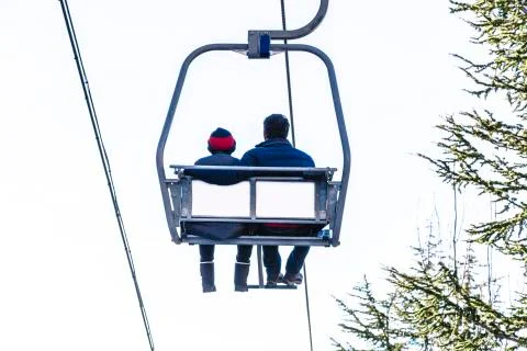 Cable car with two people going up on funicular in Sierra Nevada mountains Stock Photos